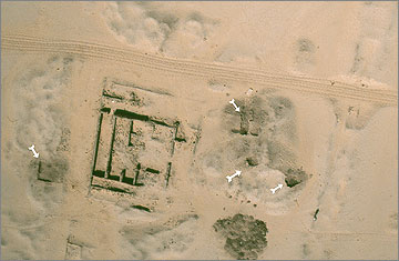 Aerial photograph of the house of Panehsy, showing excavation trenches of 2006 in the spoil heaps of the 1920s, made to recover cattle bones. North is towards the right